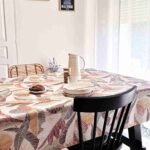 Nappe coton enduit Karma Terracotta – motif feuillage graphique terracotta, brun et safran sur fond beige
