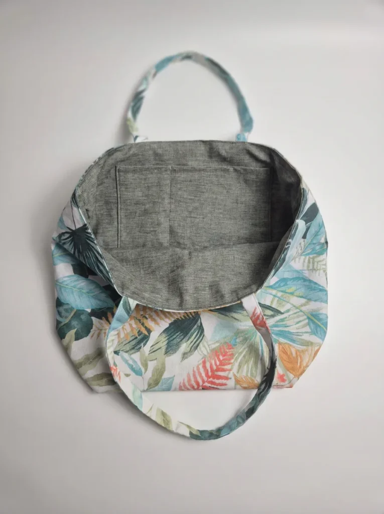 Tote bag artisanal coton enduit Bora Bora – motif feuillage tropical vert turquoise et orange, doublure polyester effet lin, anses longues porté épaule