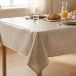 Toile cirée Uni Beige 180 cm – surface texturée façon lin, tons beige et dorés, imperméable, vendue au mètre ou sur mesure toutes formes