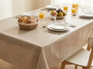 Toile cirée Uni Beige 180 cm – surface texturée façon lin, tons beige et dorés, imperméable, vendue au mètre ou sur mesure toutes formes