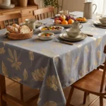 Nappe polyester feuillage doré Taillys coloris anthracite – semis de feuilles or brillant