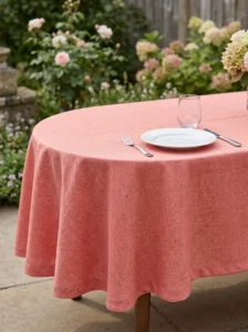Nappe polyester sur mesure Aubade terracotta drapée sur table – rendu chaleureux et estival