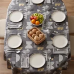 Toile cirée molletonné Ribe Or – motif géométrique graphique en gris ardoise et touches dorées, OEKO-TEX®, largeur 140 cm
