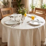 Toile cirée molletonné Chateaubry – motif damassé floral en ivoire et beige, OEKO-TEX®, largeur 140 cm