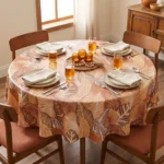 Toile cirée molletonné Mano Terracotta – grand feuillage tropical en tons terracotta et caramel, OEKO-TEX®, largeur 140 cm